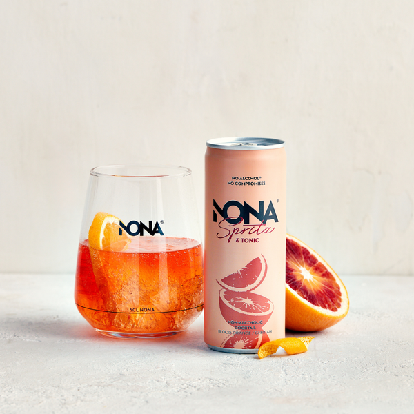 NONA Spritz alcohol free botanical cocktail served over ice with blood orange garnish